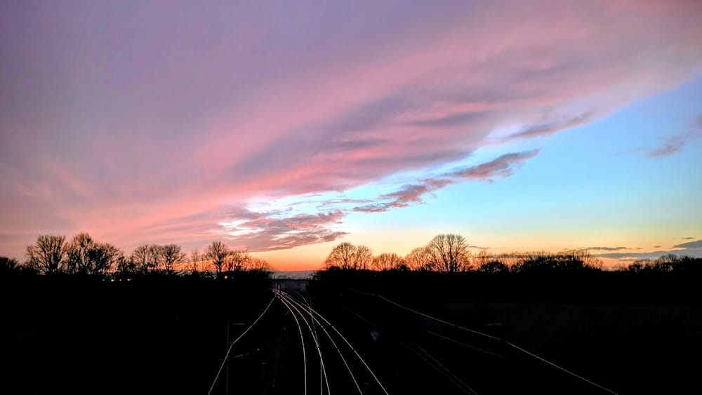 Sunset with train tracks heading into the distance