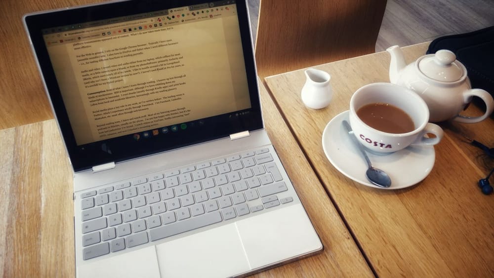 Laptop and tea in Costa