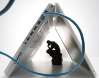 'The Thinker' and laptop