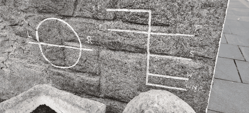 Lines on the side of a building at Seahouses, probably something to do with sailing