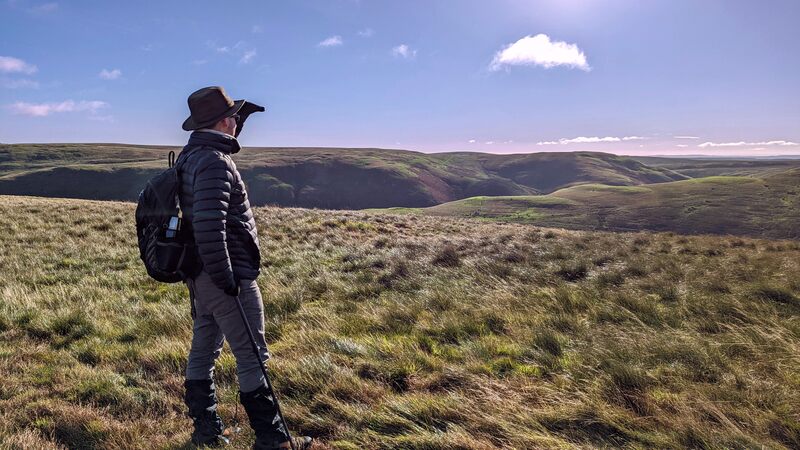 Aaron looking into the distance in Northumberland National Park